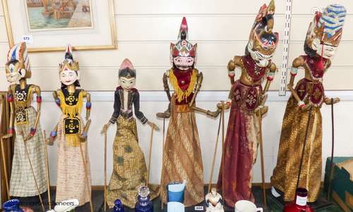 A collection of Indonesian stick puppets, tallest 76cm