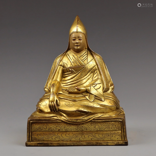 A FINLEY CASTED GILT BRONZE FIGURE OF A GURU