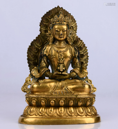 A GILT BRONZE STATUE OF A HEAVENLY KING