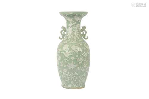 A CHINESE CELADON SLIP-DECORATED VASE.