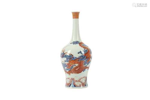 A CHINESE BLUE AND WHITE AND IRON-RED 'DRAGON AND CARP' VASE...