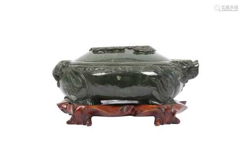 A CHINESE SPINACH GREEN JADE 'DRAGON' VESSEL AND COVER.