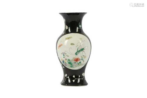 A CHINESE FAMILLE ROSE BLACK-GROUND VASE.