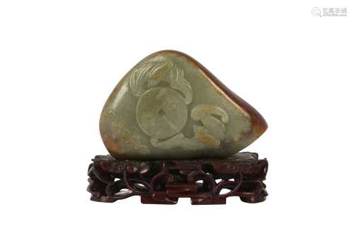 A CHINESE CELADON JADE PEBBLE CARVING.