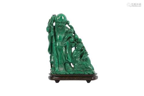 A CHINESE MALACHITE CARVING OF SHOULAO AND A BOY.