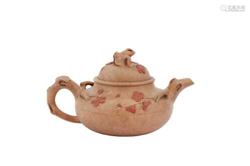 A CHINESE YIXING ZISHA 'PRUNUS' TEAPOT AND COVER.