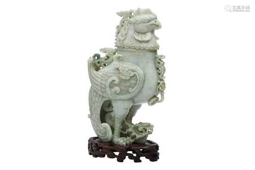 A CHINESE APPLE-GREEN JADEITE 'DRAGON AND PHOENIX' VESSEL AN...