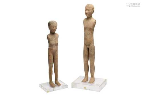 A PAIR OF CHINESE CEREMONIAL POTTERY FIGURES.