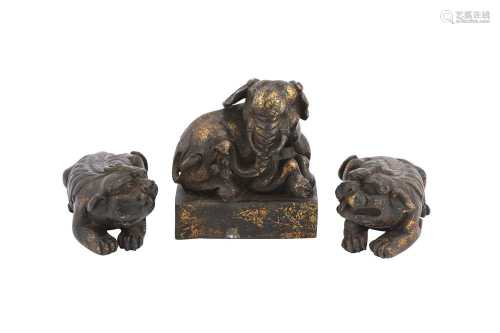 A PAIR OF CHINESE GILT-BRONZE 'QILIN' SCROLL WEIGHTS AND A G...