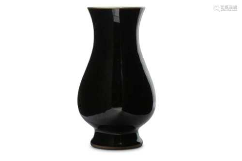 A CHINESE MIRROR BLACK-GLAZED VASE.