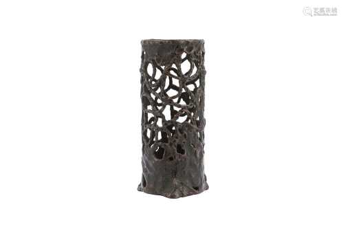 A BRONZE RETICULATED JOSS STICK HOLDER.