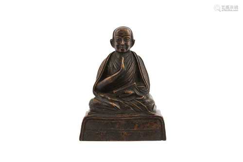 A SINO-TIBETAN COPPER ALLOY FIGURE OF A LOUHAN.