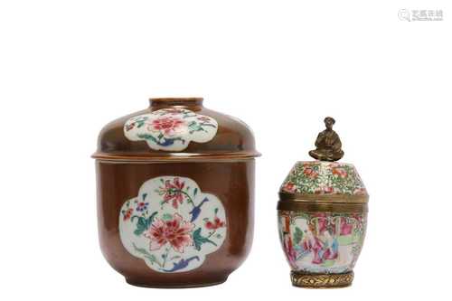 TWO CHINESE FAMILLE ROSE JARS AND COVERS.