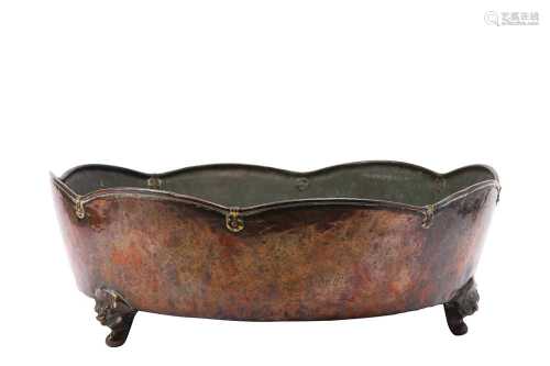 A LARGE COPPER TRIPOD BASIN.