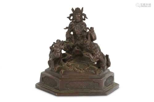 A CHINESE BRONZE MODEL OF GUANYIN.