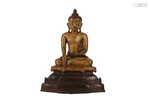 A BURMESE PARCEL-GILT BRONZE FIGURE OF BUDDHA SAKYAMUNI.