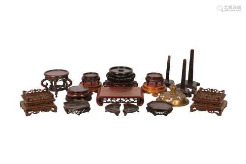 NINETEEN CHINESE WOOD STANDS AND A BRONZE COVER.