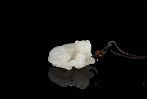 Qing - A White Jade Carved â€˜Lion and Bady Lion