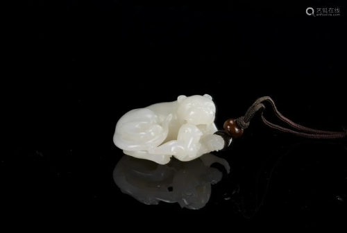 Qing - A White Jade Carved â€˜Lion and Bady Lion