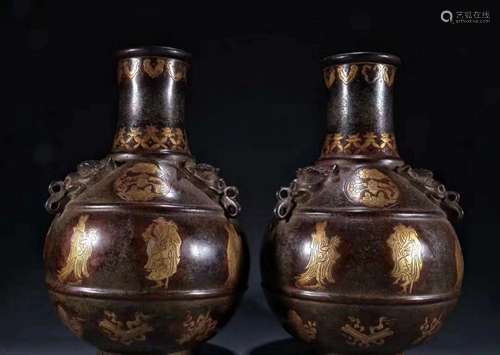 A pair of gilt bronze vases with the eight immortals