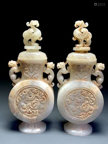 A pair of jade vases with dragon phoenix pattern