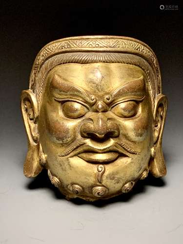 Gilt bronze head of the God of Wealth