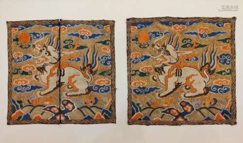 A pair of embroidered lions