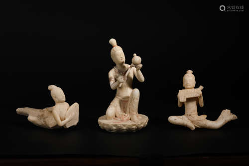A set of stone figurines made of stone playing music in the ...