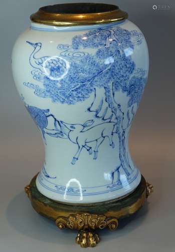 A CHINESE BLUE AND WHITE VASE WITH BRONZE FITTING,DRILLED ,H...