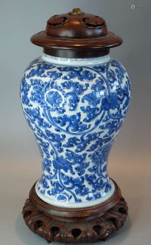 A CHINESE BLUE AND WHITE VASE WITH HARDWOOD STAND AND COVER ...