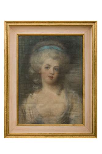 Portrait of young woman with hairstyle with blue ribbon