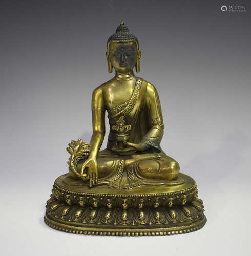 A Chinese gilt bronze figure of Buddha, 20th century, modell...