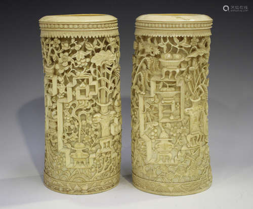 A pair of Chinese ivory tusk vases, late 19th century, each ...