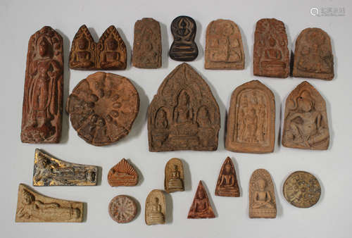 A group of twenty-one Thai pottery votive plaques/tablets, v...