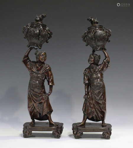 A pair of Japanese brown patinated cast bronze figures by Mo...