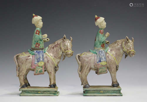 A pair of Chinese enamelled biscuit porcelain figures of a h...