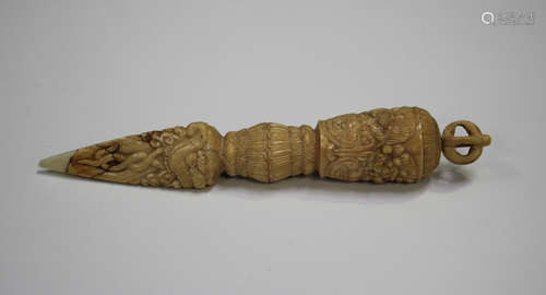 A Tibetan carved ivory phurba, Qing dynasty, the handle carv...