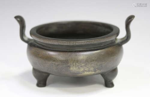 A Chinese wire inlaid brown patinated bronze tripod censer, ...