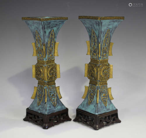 A pair of Chinese turquoise enamelled and gilt moulded biscu...