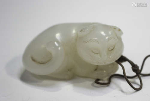 A Chinese white jade pendant, Qing dynasty, carved in the fo...
