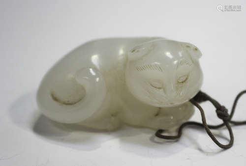 A Chinese white jade pendant, Qing dynasty, carved in the fo...