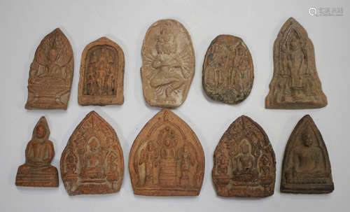 A group of ten Thai pottery votive plaques/tablets, various ...