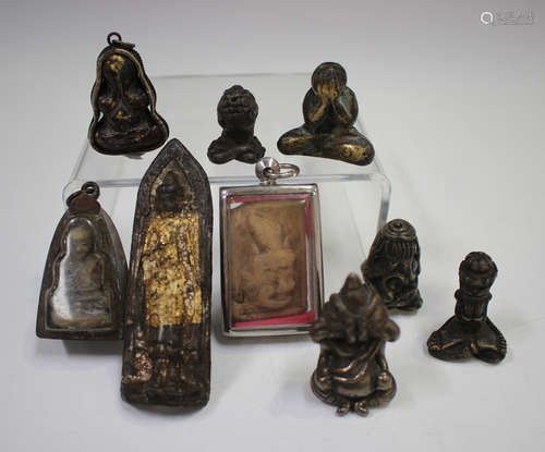 A small group of Thai amulets, including bronze Phra Pidta f...