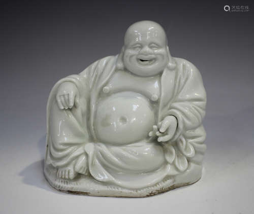 A Chinese blanc-de-Chine porcelain figure of Buddha, late Qi...