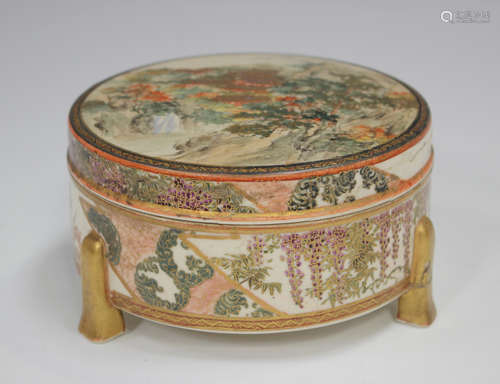 A Japanese Satsuma earthenware circular box and cover by Izu...