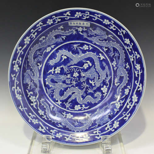 A Chinese blue and white circular dish, mark of Kangxi but m...