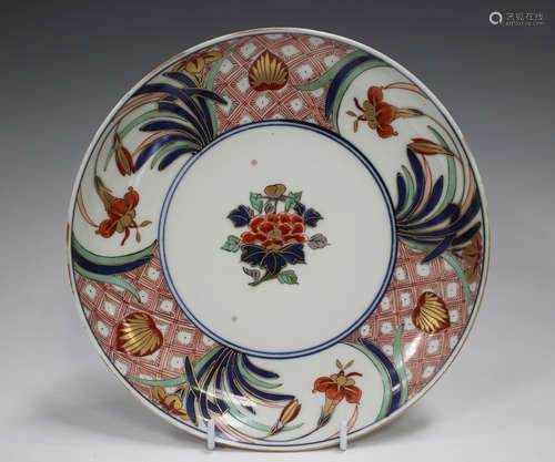 A Japanese Imari circular dish, Edo period, painted and gilt...