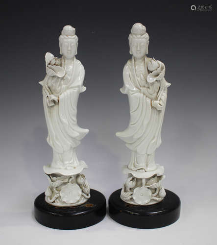 A pair of Chinese blanc-de-Chine porcelain figures of Guanyi...