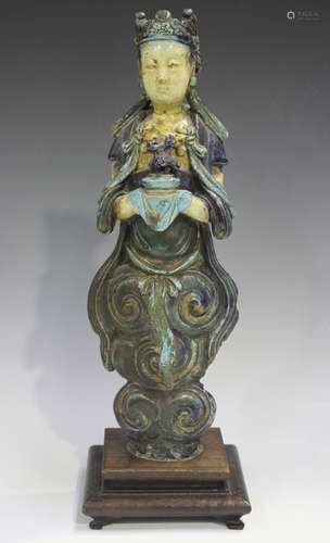 A Chinese Fahua glazed pottery figure of Guanyin, Ming dynas...