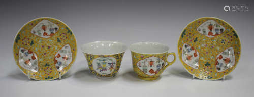 A Chinese famille rose enamelled yellow ground porcelain tea...